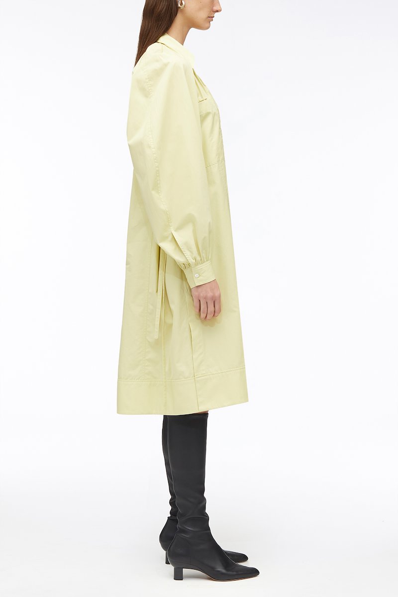 Shirred Puff Sleeve Classic Poplin Shirt Dress-yellow #1 Shirred Puff Sleeve Classic Poplin Shirt Dress, shirred puff-sleeves shirt dress from 3.1 PHILLIP LIM featuring citron pale yellow, cotton, shirred effect, classic collar, V-neck, two chest patch pockets, rear tie fastening, long puff sleeves and below-knee length.- 1