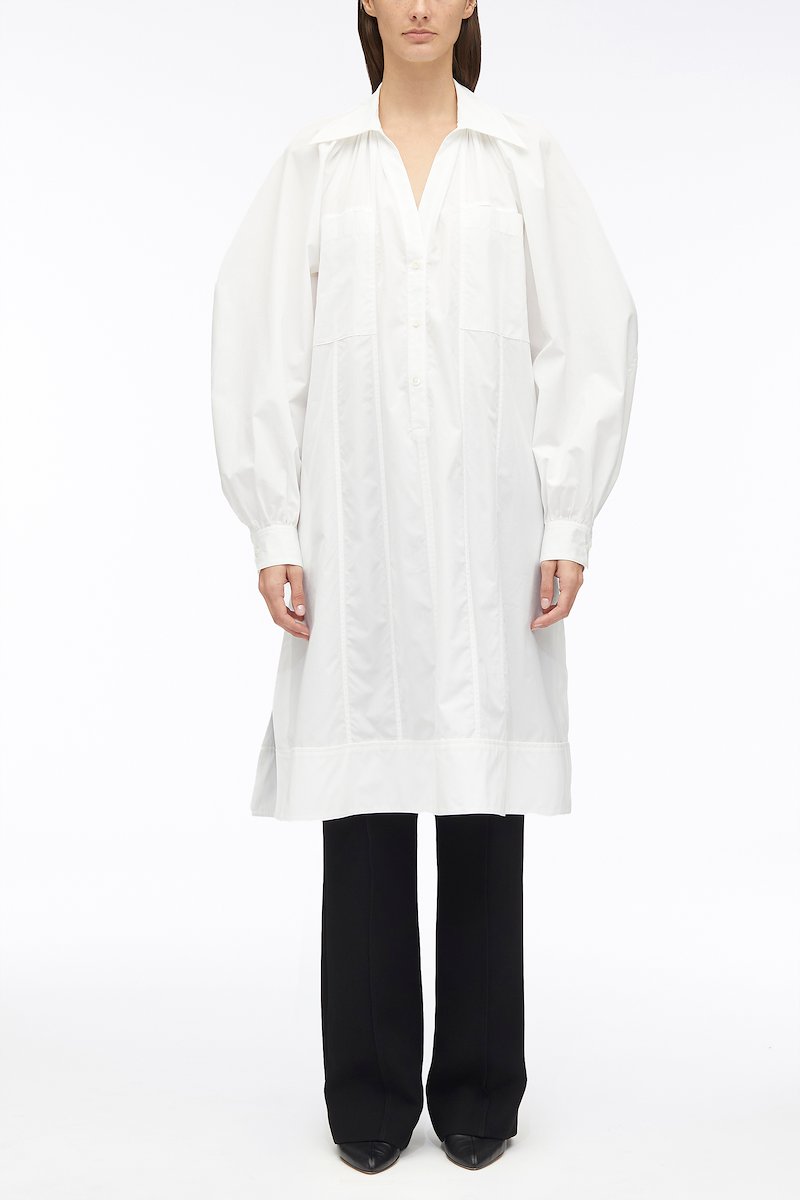 Shirred Puff Sleeve Classic Poplin Shirt Dress-white #1 Shirred Puff Sleeve Classic Poplin Shirt Dress, shirred puff sleeves shirt dress from 3.1 PHILLIP LIM featuring white, cotton, poplin texture, shirred effect, classic collar, V-neck, long puff sleeves, chest patch pocket and below-knee length.- 1