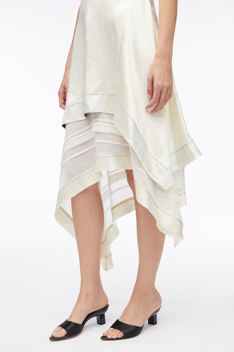 Asymmetric Hem Sleeveless Satin Combo Dress-white #1 Asymmetric Hem Sleeveless Satin Combo Dress, asymmetric satin mid dress from 3.1 PHILLIP LIM featuring cream white, satin weave, layered design, contrast stitching, crew neck, sleeveless, asymmetric hem and below-knee length.- 3