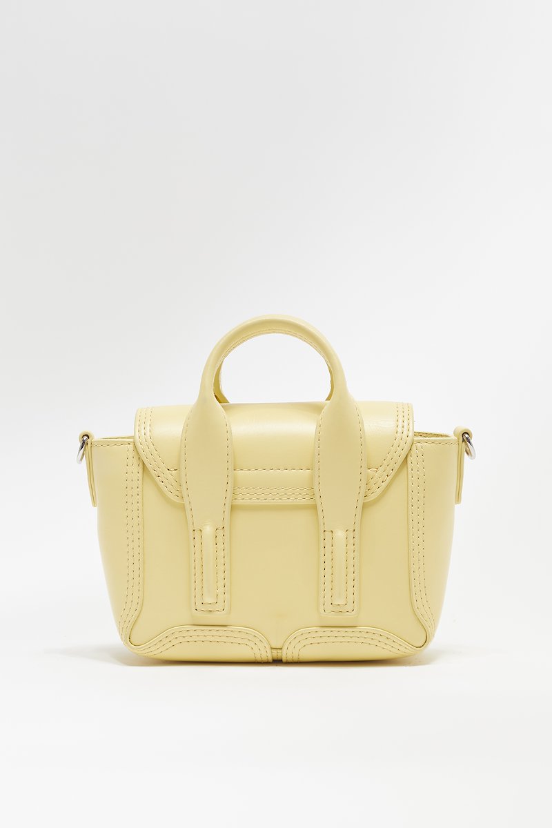 Pashli Nano Satchel -yellow #0 Pashli Nano Satchel , Pashli Nano satchel from 3.1 PHILLIP LIM featuring lemon, calf leather, engraved logo, silver-tone hardware, adjustable detachable shoulder strap, two top handles, foldover top, push-lock fastening and main compartment.- 2