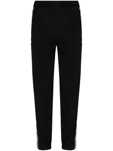 Givenchy logo tape track pants Men