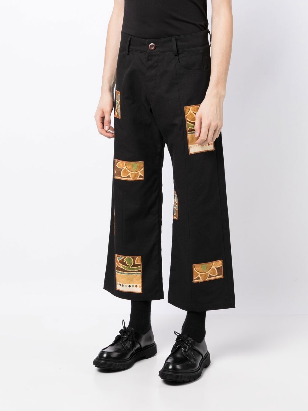Shop Bethany Williams Patch-detail Cropped Trousers In Black