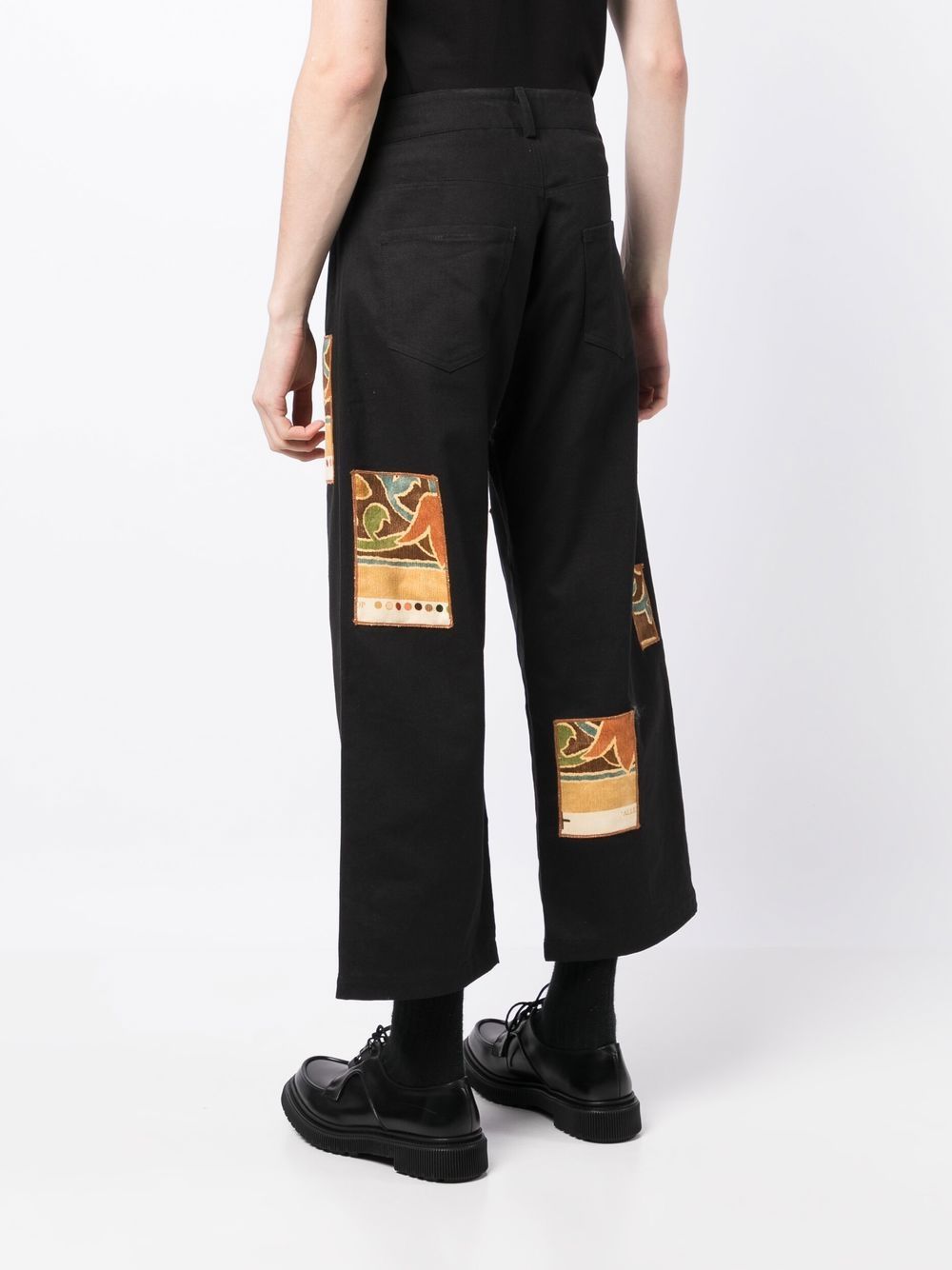 Shop Bethany Williams Patch-detail Cropped Trousers In Black