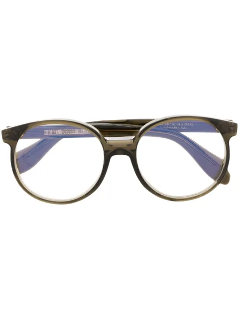 Cutler & Gross Runde Brille mit scheinend Design