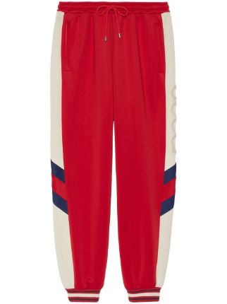 Red track pants sales with white stripe