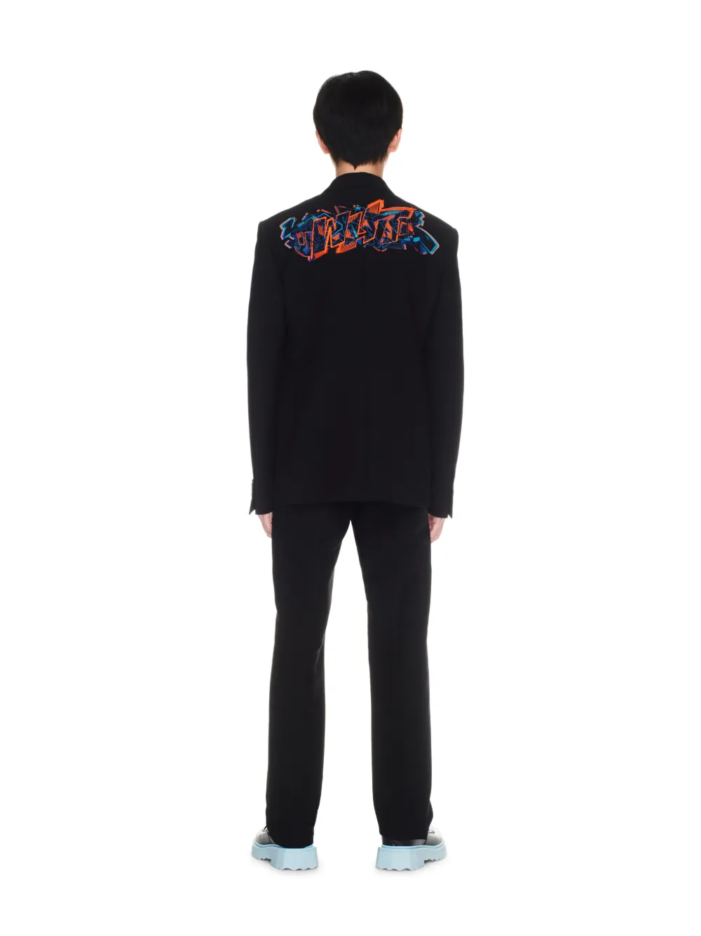 Pantaloni slim con applicazione graffiti