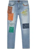 Alanui baggy-cut patchwork-design jeans - Blue