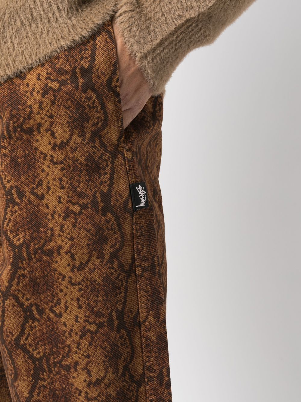 Shop Stussy Snakeskin-print Cotton Trousers In Brown