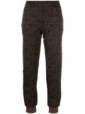 Moschino monogram-print joggers - Brown