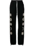 AMIRI graphic-print trousers - Black