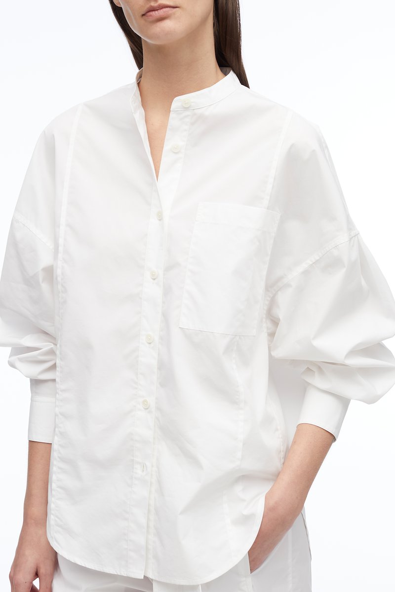 Long Sleeve Band Collar Poplin Shirt -white #0 Long Sleeve Band Collar Poplin Shirt , band collar oversized shirt from 3.1 PHILLIP LIM featuring white, cotton blend, band collar, drop shoulder, front button fastening, oversize arms, chest patch pocket, buttoned cuffs and curved hem.- 4