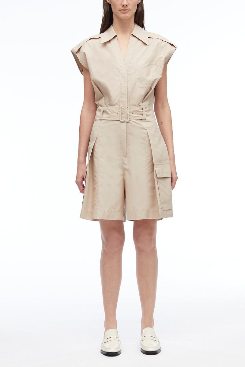 Sleeveless Utility Collared Romper-neutrals #0 Sleeveless Utility Collared Romper, pleat detail belted playsuit from 3.1 PHILLIP LIM featuring sand beige, cotton blend, pleat detailing, belted waist, classic collar, rear elasticated waistband, chest patch pocket, two side flap pockets and short sleeves.- 0