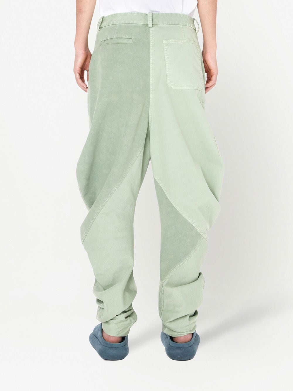 Shop Jw Anderson Twisted Cotton Trousers In Green