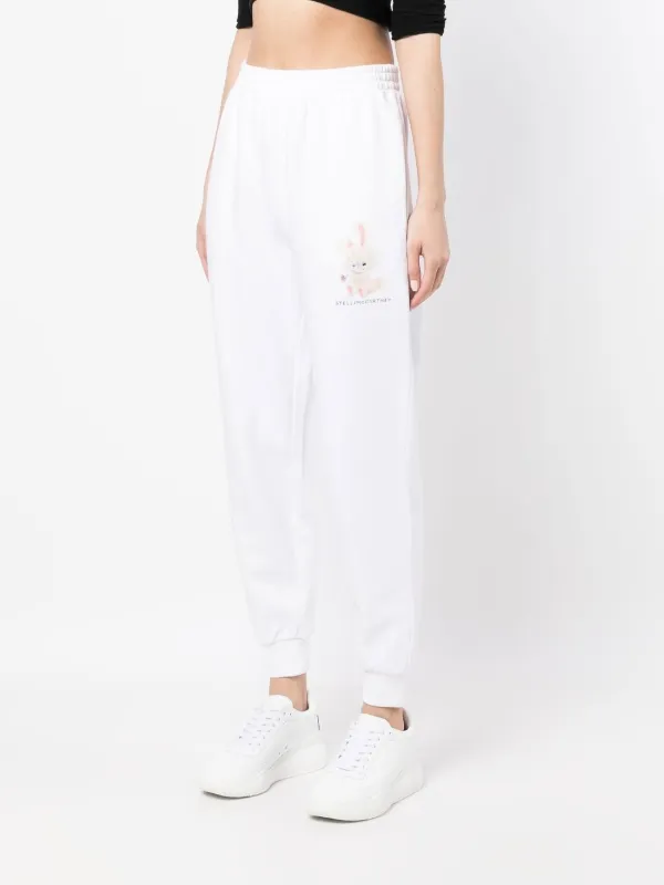 STELLAMCCARTNEYパンツ Stella McCartney graphic-print Tapered Track Pants | White | FARFETCH