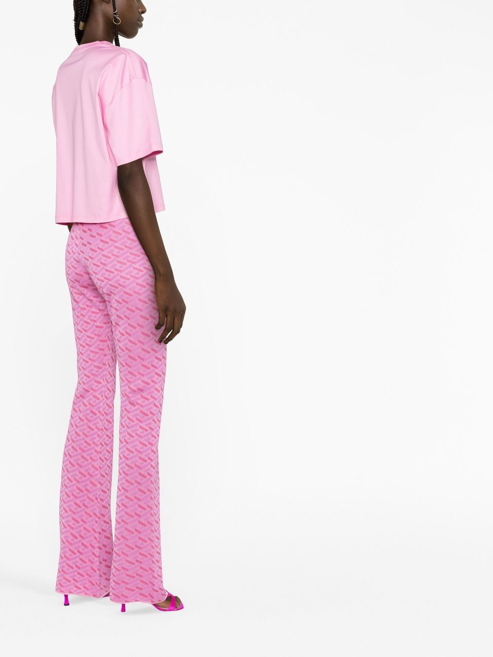Shop Versace La Greca Jacquard Flared Trousers In Pink