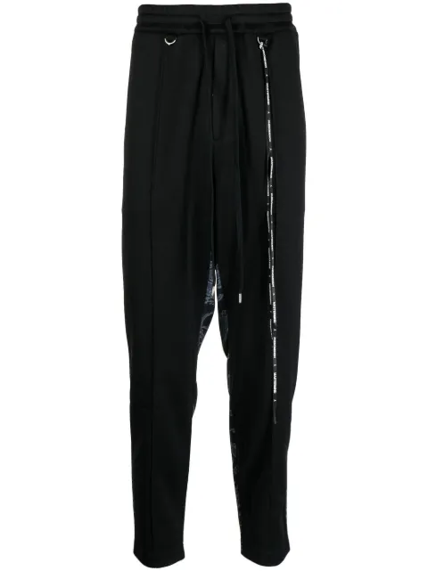 Mastermind World pants con estampado militar