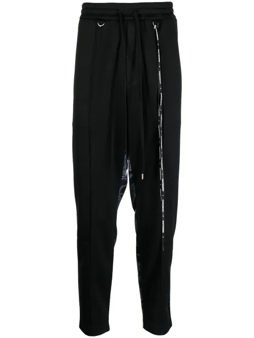 Pantalon de jogging à imprimé camouflage - Mastermind World - Modalova