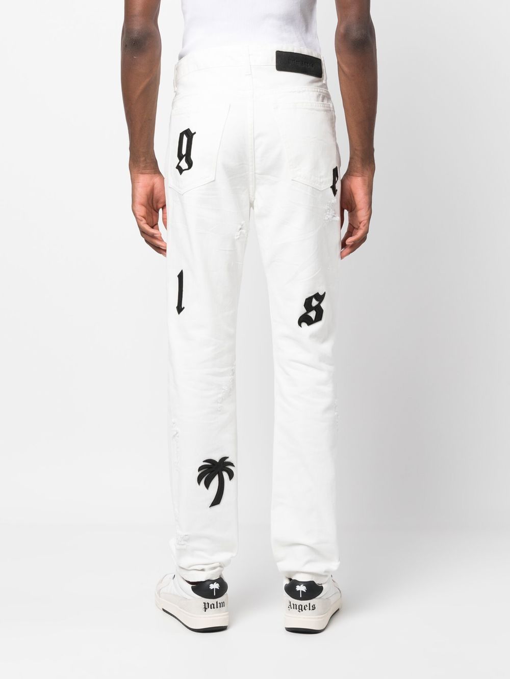 Palm Angels logo-patch Distressed Jeans - Farfetch