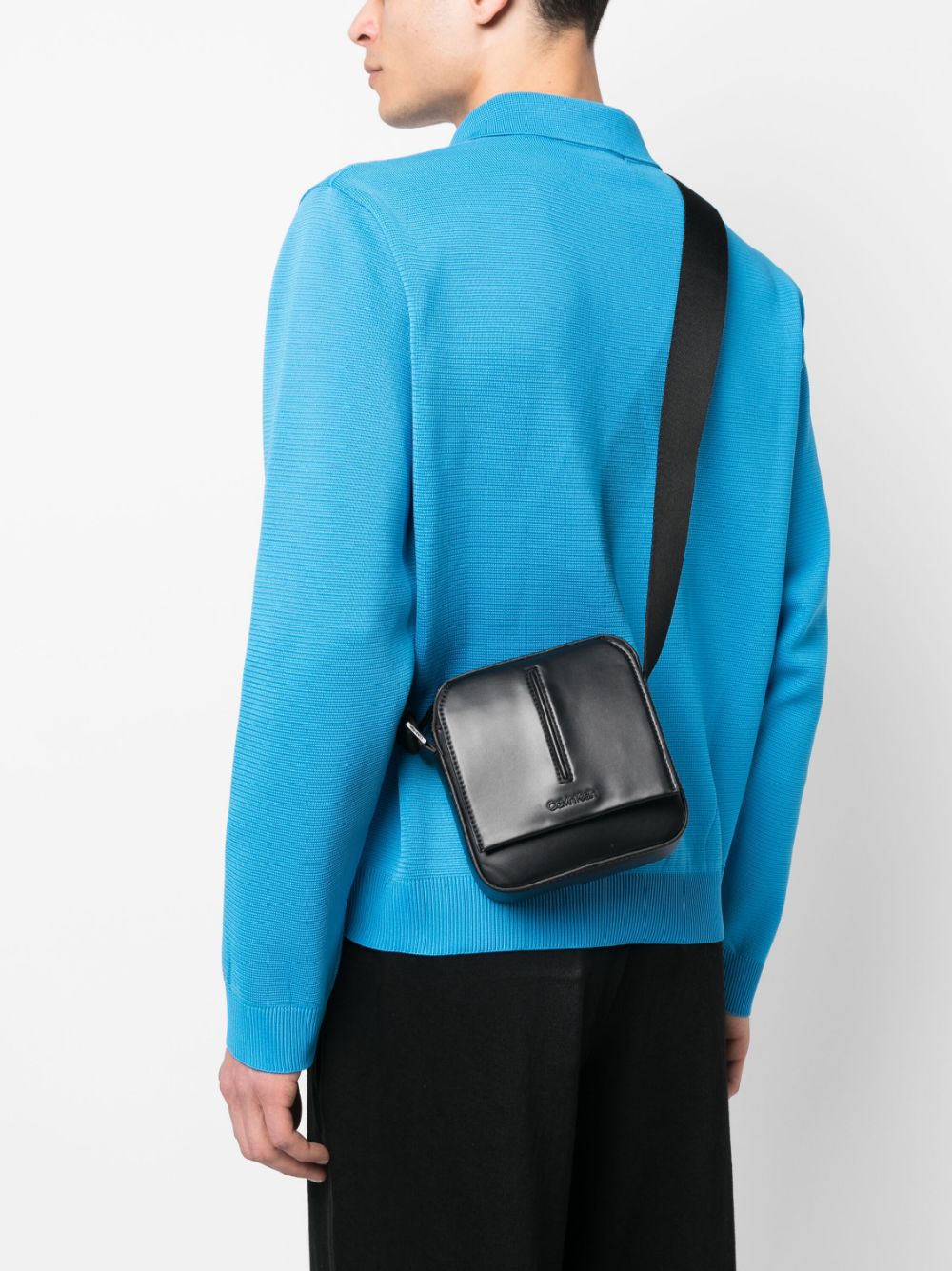 Shop Calvin Klein Embossed-logo Messenger Bag In Black