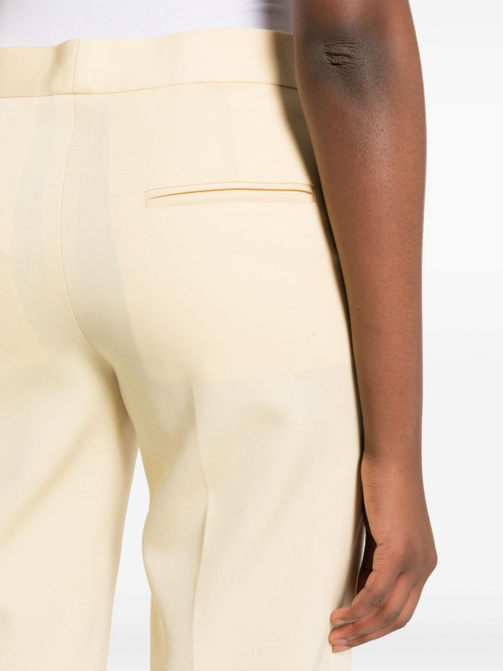 Shop Jil Sander Pressed-crease Wool Slim-fit Trousers In Yellow