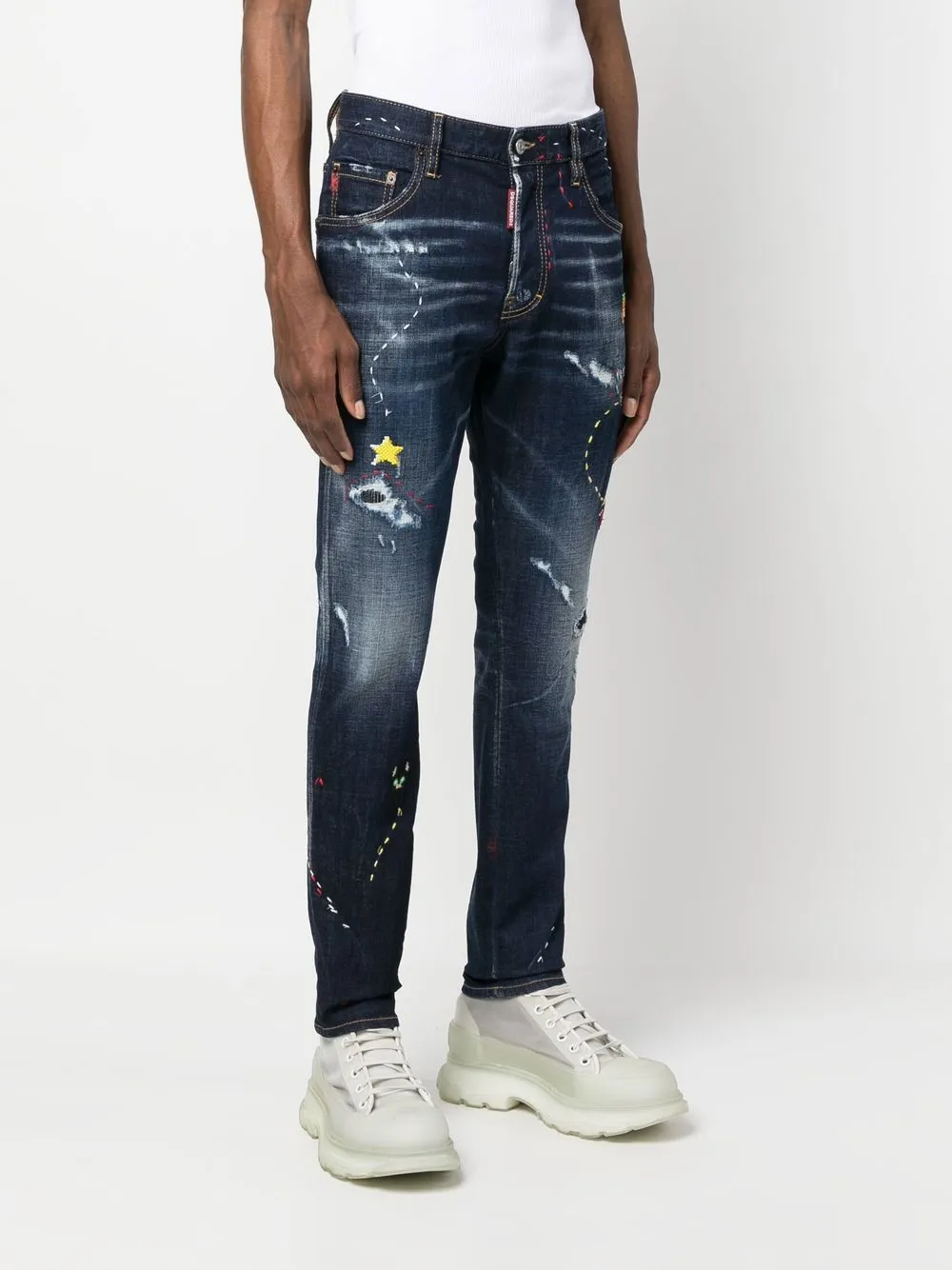 illustrated distressed skinny jeans