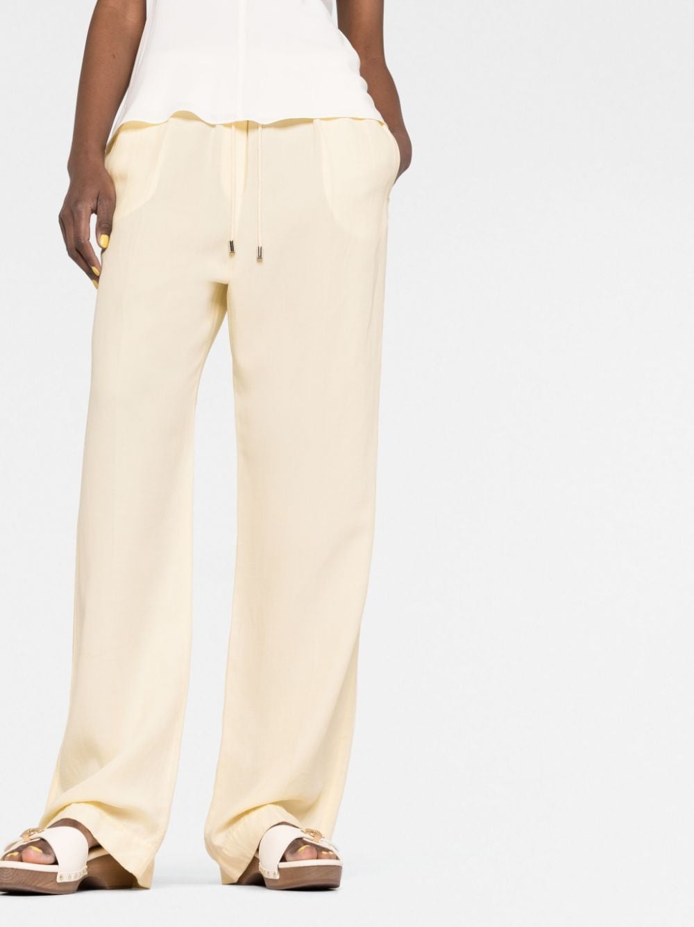 Shop Totême Straight-leg Drawstring Trousers In Yellow