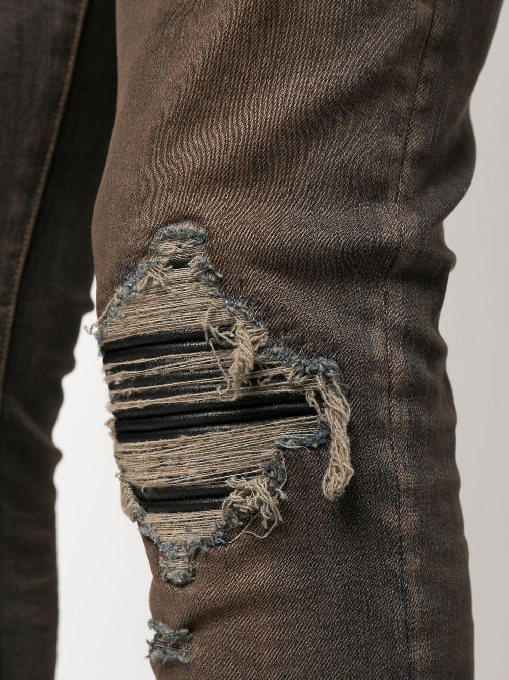 MX1 distressed skinny-cut jeans