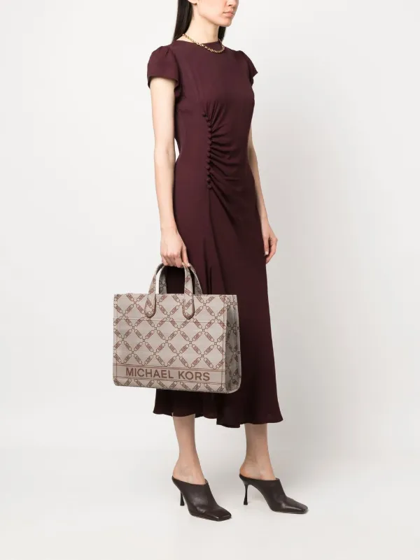 Buy the Michael Kors Brown Signature Monogram Mini Tote Bag