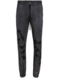 AMIRI Pigment Spray Star track pants - Black