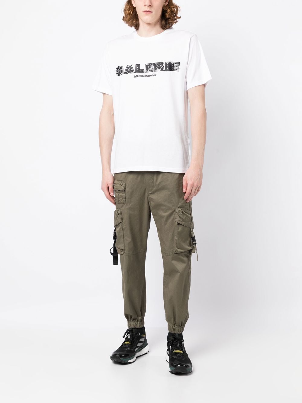 Musium Div. Studded logo-print T-shirt - Farfetch