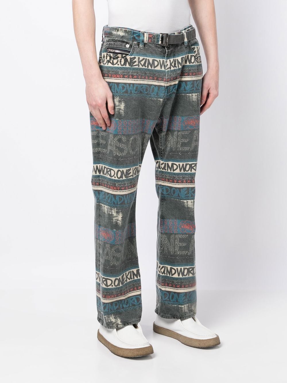 Shop Sacai Slogan-print Cotton Jeans In Blau