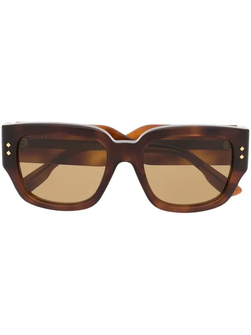 Lunettes de soleil à effet écaille de tortue - Gucci Eyewear - Modalova