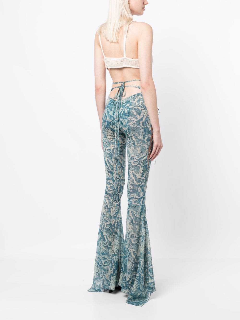 Shop Knwls Glimmer Graphic-print Flared Trousers In Blue