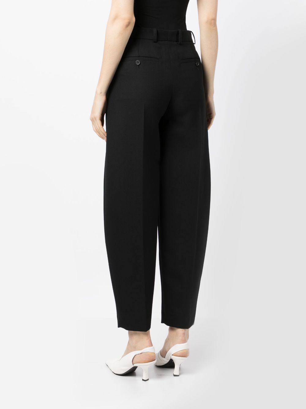Shop Totême High-waisted Tapered Trousers In Schwarz