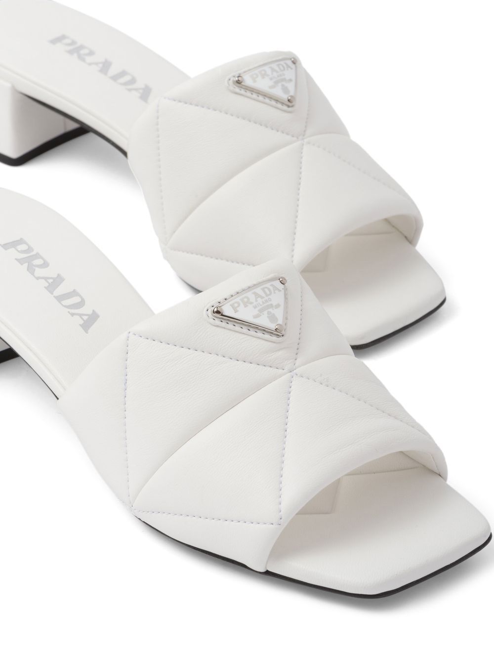 Shop Prada Logo-plaque Quilted Leather Mules In Weiss