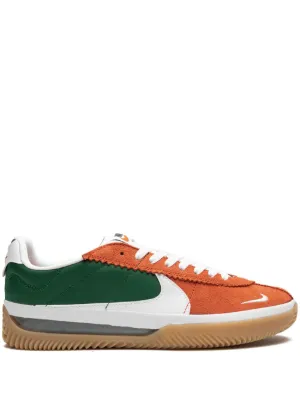 Orange and green clearance nikes