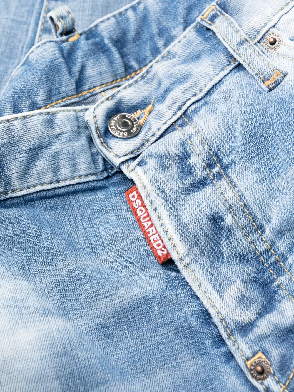Distressed-Finish Tapered-Leg Jeans