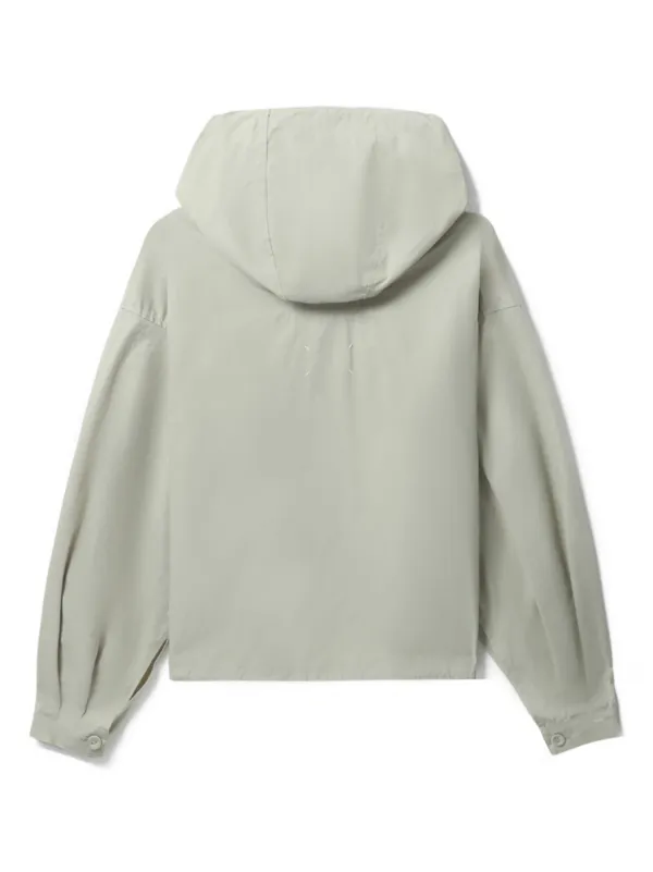 Hooded jacket with outlet pouch pocket