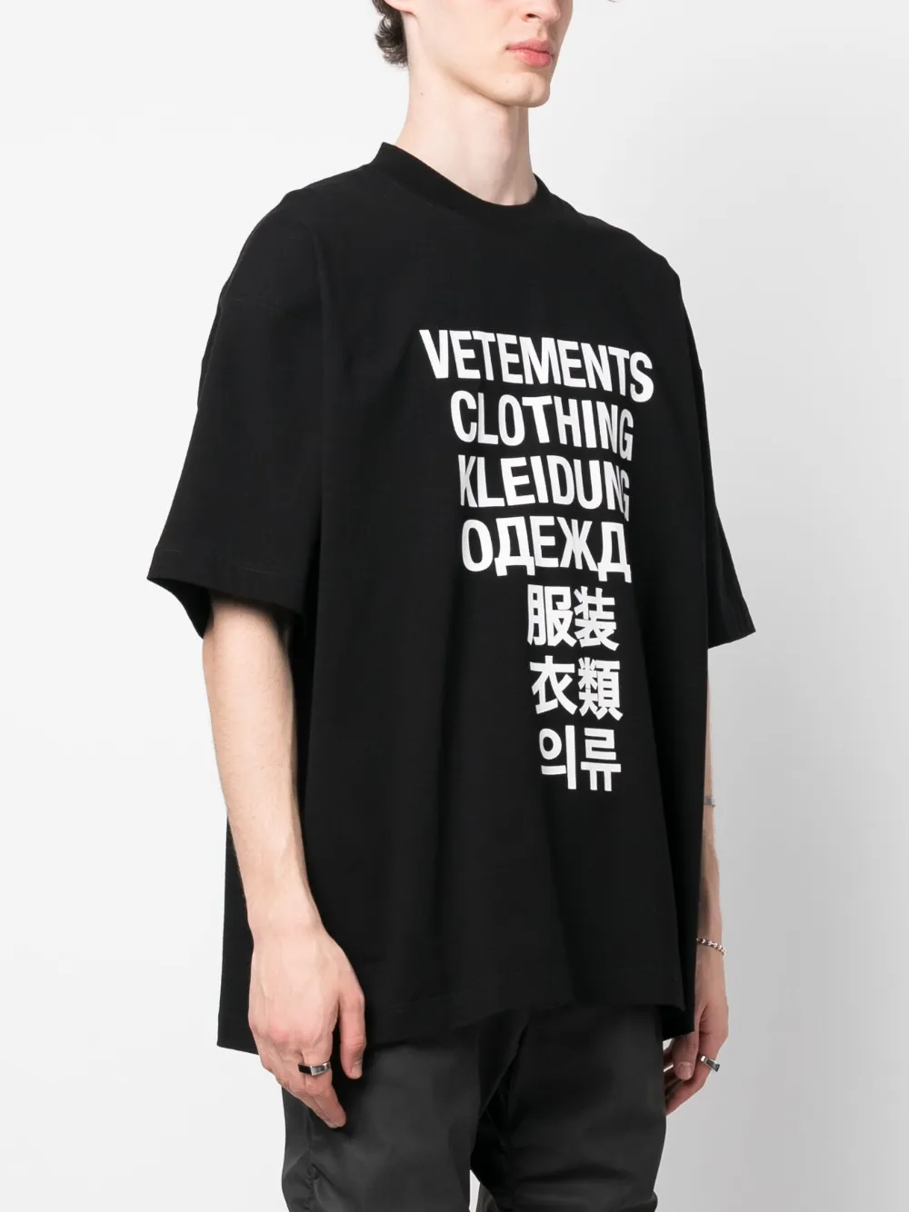 VETEMENTS Translation logo-print T-shirt - Farfetch