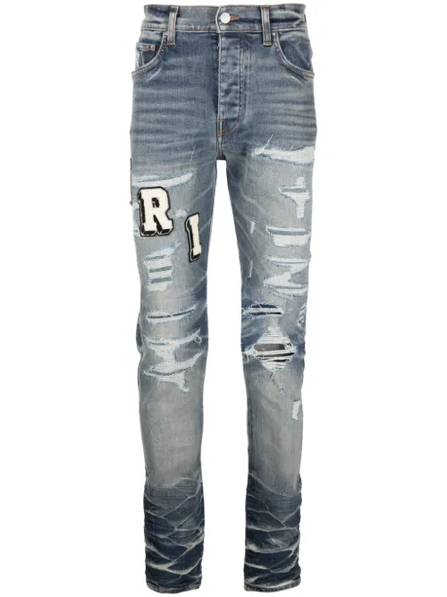 Jean skinny à effet usé - AMIRI - Modalova