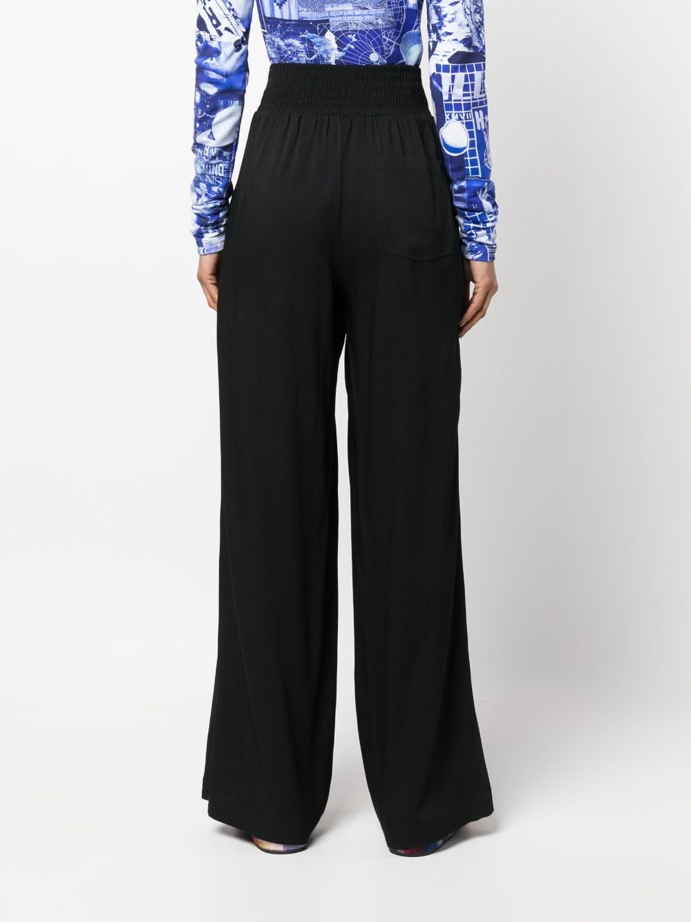 Shop Moschino Pleated Wide-leg Trousers In Black