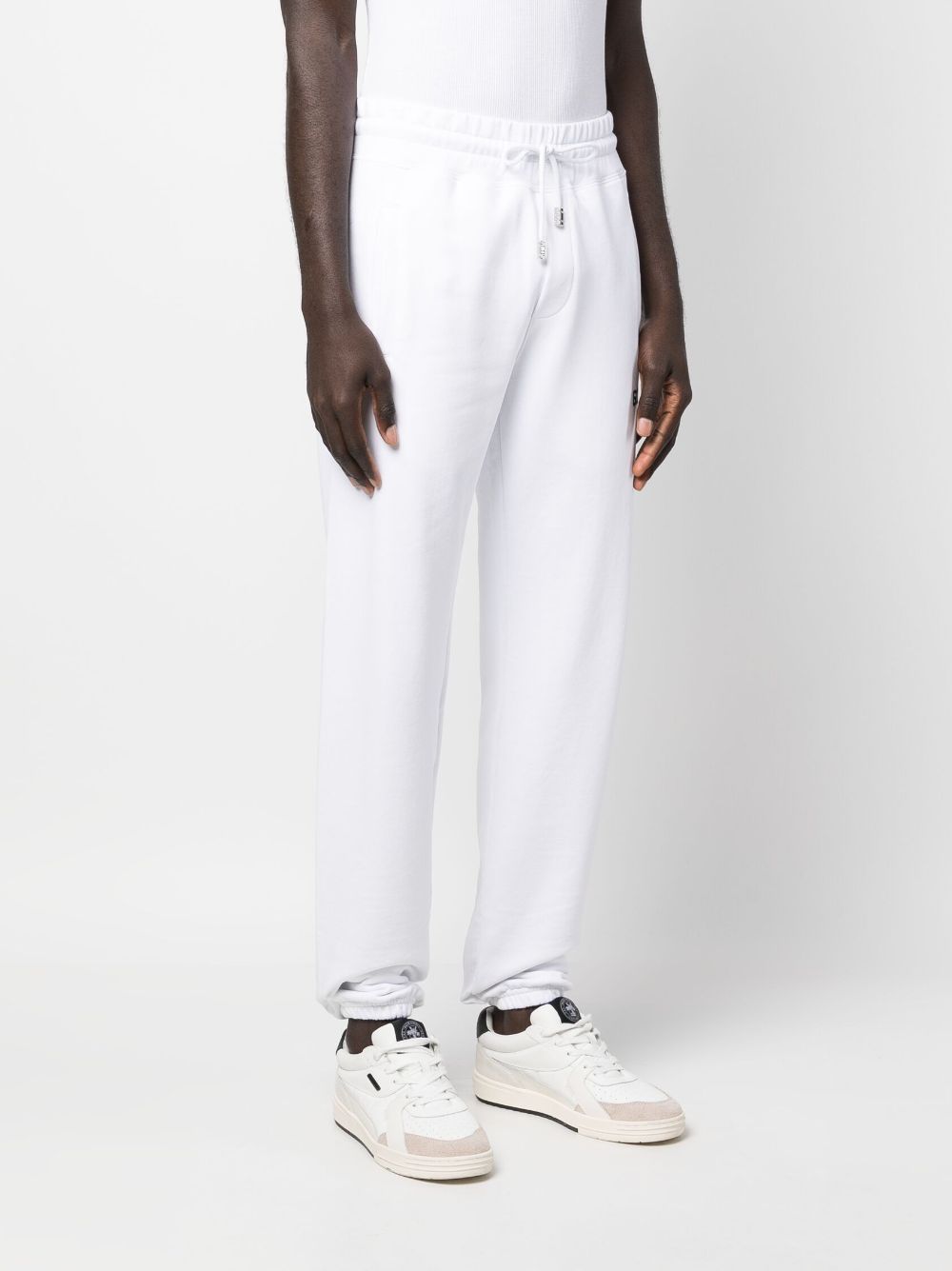 Shop Gcds Tapered-leg Drawstring Trousers In White