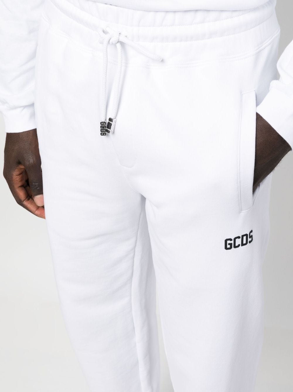 Shop Gcds Tapered-leg Drawstring Trousers In White