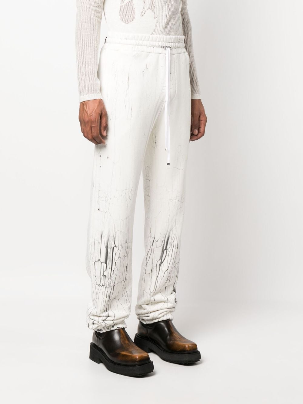 Shop Amiri Cracked-print Track Pants In White