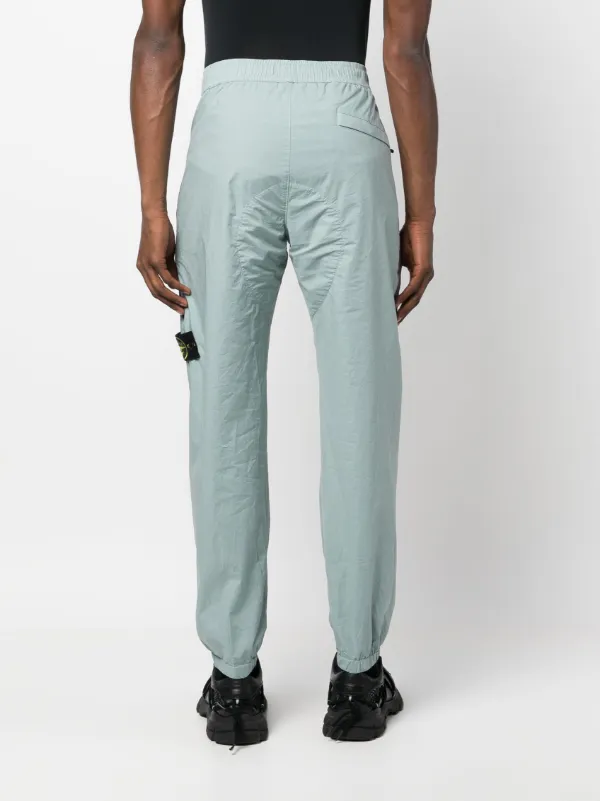Stone Island コンパスパッチ トラックパンツ | ブルー | FARFETCH JP