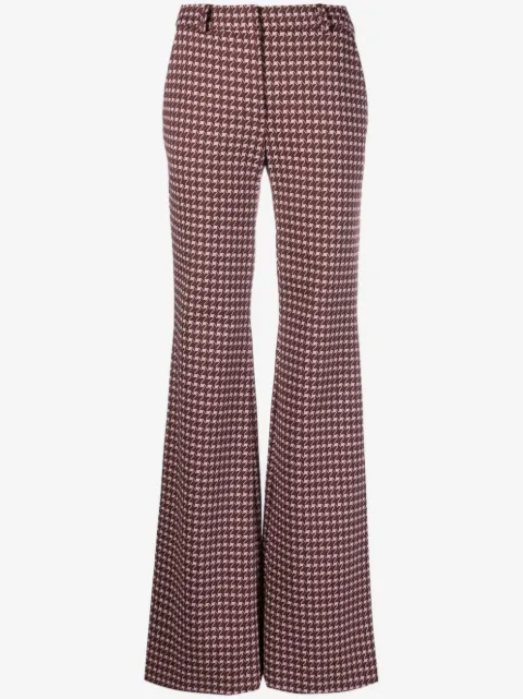 Moschino pantalones acampanados con estampado gráfico