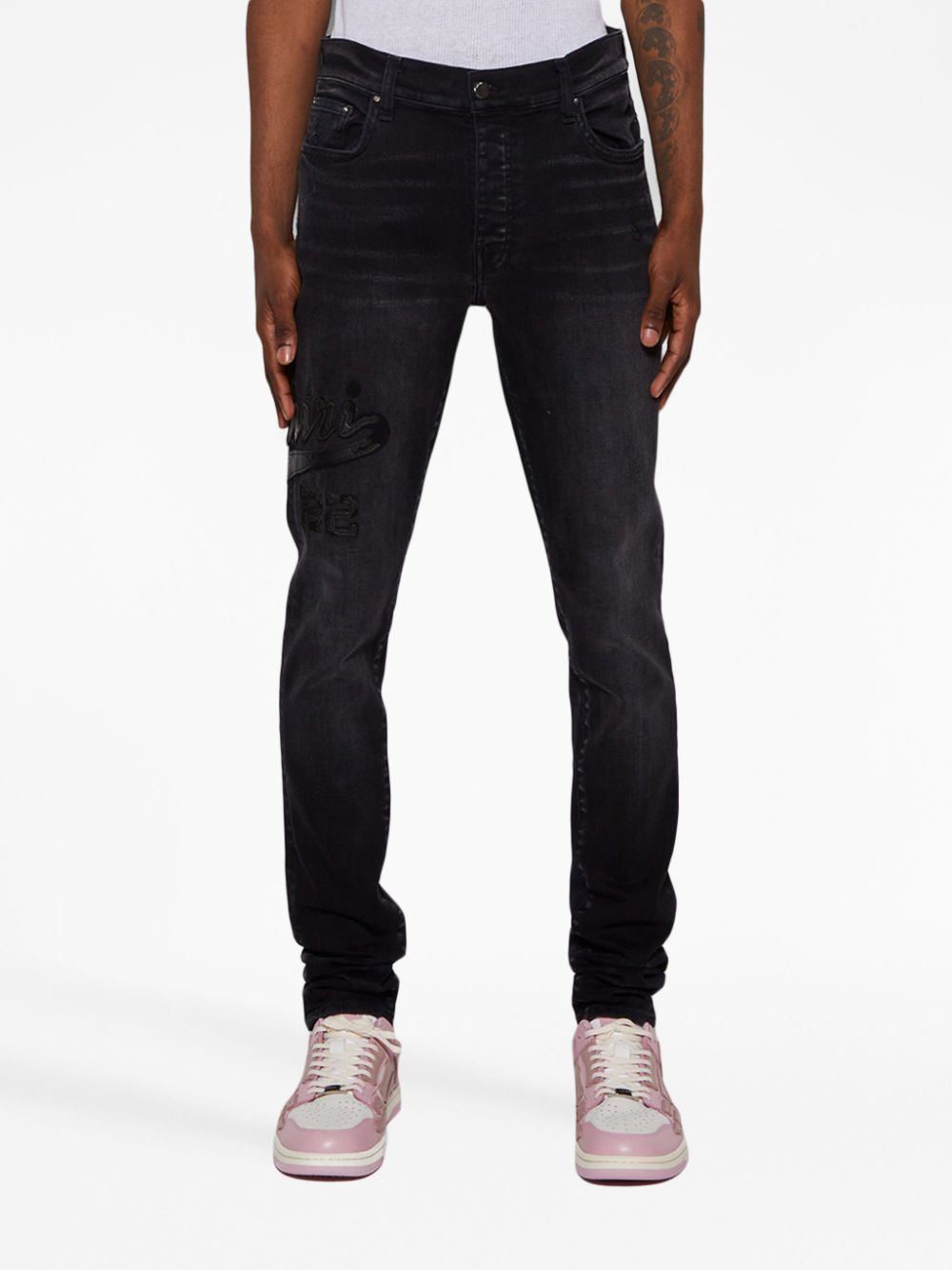 AMIRI Varsity Logo Appliqué Skinny Jeans - Farfetch