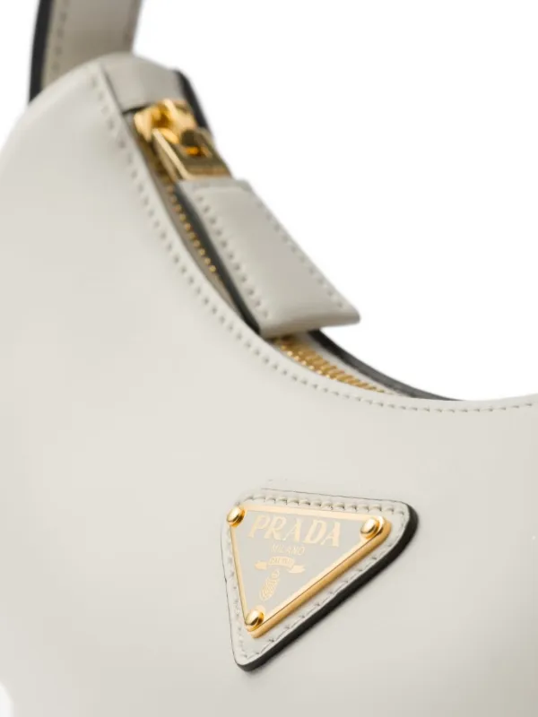 Prada Small Arqué Leather Shoulder Bag | White | FARFETCH CA