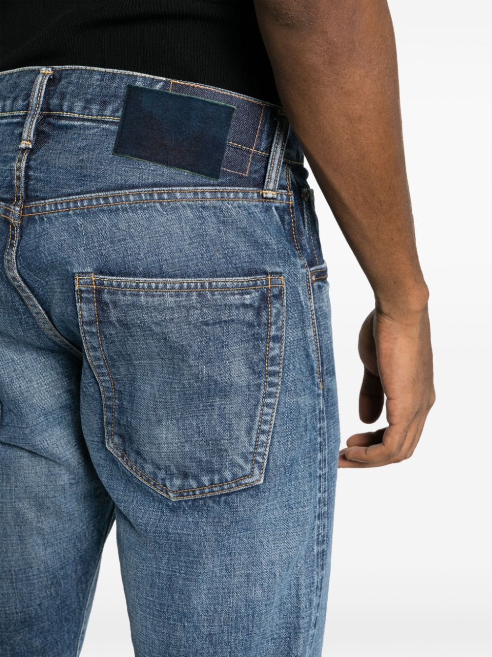 Shop Visvim Logo-patch Cotton Straight-leg Jeans In Blue