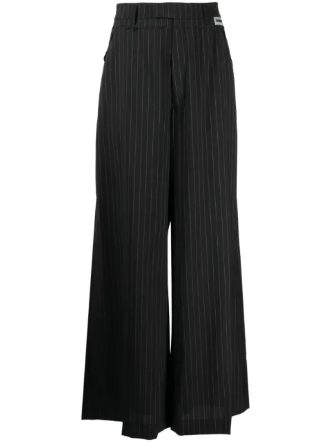 VETEMENTS pantalones anchos con rayas diplomáticas estampadas
